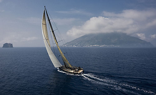DSK Pioneer Investments (ITA) sailing towards Strombolicchio with Stromboli in the background, during the Rolex Capri Sailing Week and Rolex Volcano Race, Capri, Italy. Photo copyright Rolex and Carlo Borlenghi.