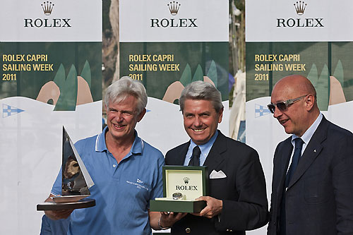 Andres Soriano, Alegre, receives a Rolex timepiece from Gian Riccardo Marini, CEO of Rolex SA, with Massimo Massaccesi, President of YCC, during the Rolex Capri Sailing Week and Rolex Volcano Race, Capri, Italy. Photo copyright Rolex and Carlo Borlenghi.