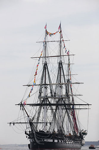 The three-masted heavy frigate of the United States Navy, the USS Constitution, seen out on Boston Harbour for Independence Day, during the final day of Act 4 of the Extreme Sailing Series 2011, Boston, USA. Photo Copyright Lloyd Images.