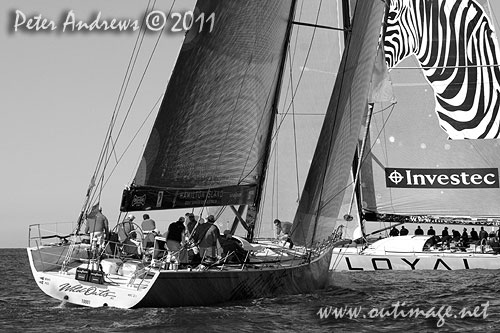 Anthony Bell's 100 ft maxi Investec Loyal and Bob Oatley's Reichel Pugh 100 Wild Oats XI tacking duel out of Sydney Harbour, after the start of the Audi Sydney Gold Coast 2011. Photo copyright Peter Andrews, Outimage Australia.
