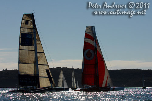 The trimarans Banque Populaire IV and Vodafone, shadowed the fleet from the start of the Audi Sydney Gold Coast 2011. Photo copyright Peter Andrews, Outimage Australia.