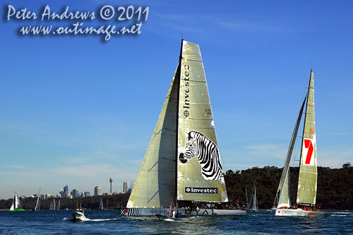 Anthony Bell's 100 ft maxi Investec Loyal and Bob Oatley's Reichel Pugh 100 Wild Oats XI tacking duel out of Sydney Harbour, after the start of the Audi Sydney Gold Coast 2011. Photo copyright Peter Andrews, Outimage Australia.