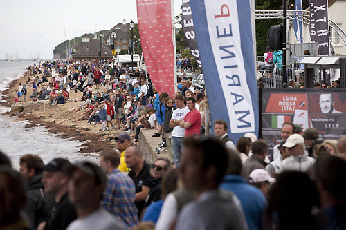 Crowds line the shoreline for Act 5 of the Extreme Sailing Series 2011, Cowes, United Kingdom. Photo copyright Lloyd Images.