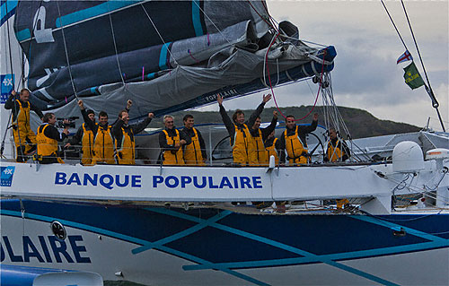 Loick Peyron's Maxi Banque Populaire crew celebrating their record at Plymouth, during the Rolex Fastnet Race 2011. Photo copyright Rolex and Carlo Borlenghi.