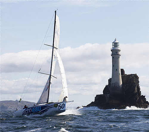 Benoit Daval's Class 40 Techneau (FRA) rounding Fastnet Rock, during the Rolex Fastnet Race 2011. Photo copyright Rolex and Daniel Forster.