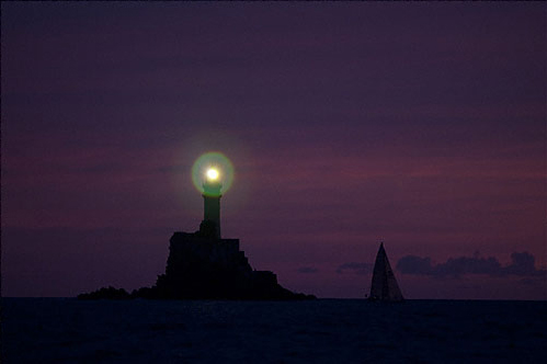 Passing Fastnet Rock at night, during the Rolex Fastnet Race 2011. Photo copyright Rolex and Daniel Forster.