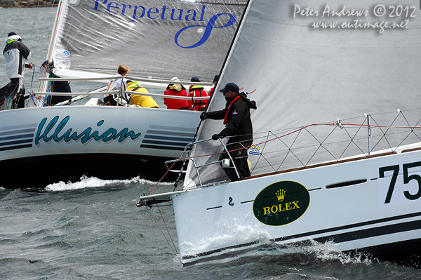 The bowman on Chris Tucker's Beneteau First 40, Halcyon, keeping an eye on Kim Jaggar and Travis Read's Davidson 34, Illusion, on Sydney Harbour ahead of the start of the 2012 Sydney Hobart Yacht Race. Photo copyright Peter Andrews, Outimage Australia.
