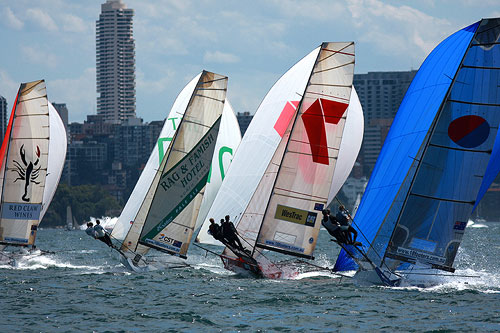 The 18 Footer fleet on their first spinnaker run on Sydney Harbour, during last year's Syd. Barnett memorial Trophy. Photo copyright Australian 18 Footers League.