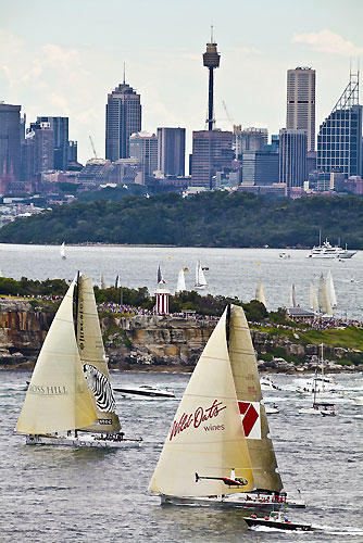 Bob Oatley's Wild Oats XI and Sean Langman and Anthony Bell's Elliott Maxi Investec Loyal, outside the heads of Sydney Harbour after the start of the Rolex Sydney Hobart 2010, Australia. Photo copyright Carlo Borlenghi, Rolex.