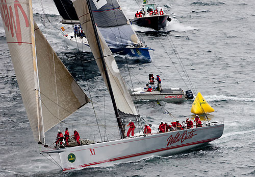 Bob Oatley's Wild Oats XI ahead of Grant Wharington's Maxi Wild Thing, after the start of the Rolex Sydney Hobart 2010. Photo copyright Carlo Borlenghi, Rolex.