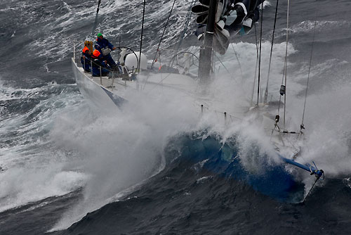 Grant Wharington's Maxi Wild Thing under reduced sail dealing with the conditions of the Tasman Sea, during the Rolex Sydney Hobart Yacht Race 2010, Australia. Photo copyright Carlo Borlenghi, Rolex.