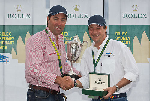 Wild Oats XI skipper Mark Richards and Patrick Boutellier from Rolex Australia with the JH Illingworth Trophy and Rolex Yacht-Master timepiece for the Line Honours winner of the Rolex Sydney Hobart Yacht Race 2010, Australia. Photo copyright Carlo Borlenghi, Rolex.