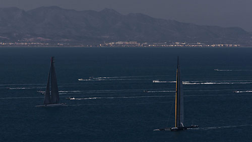 Valencia, Spain, February 12, 2010. Alinghi 5 and USA 17 with the mountains behind Valencia in the background, on day 5 during Race 1 of the 33rd America's Cup. Photo copyright Carlo Borlenghi / Alinghi.