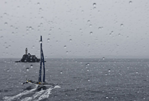 Gitana, Trimaran approaching Fastnet Rock in the rain, 15/08/2011, during the Rolex Fastnet Race 2011, Cowes - Plymouth, UK. Photo copyright Rolex and Carlo Borlenghi.