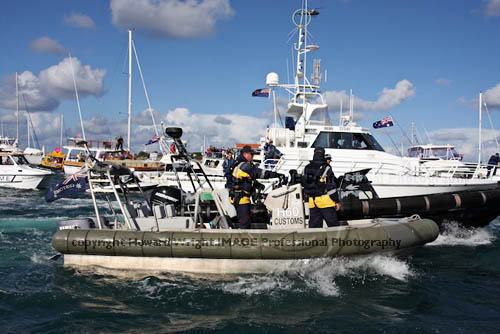 Local Customs Officials the first to greet Jessica Watson onboard her S&S 34 Ella's Pink Lady on Sydney Harbour Saturday May 15, 2010. Photo copyright Howard Wright, IMAGE Professional Photography.