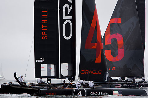 James Spithill's and Russell Coutts' ORACLE Racing AC45 wing-sailed catamarans at the America's Cup World Series, Cascais, Portugal, August 6-14, 2011. Photo copyright Morris Adant.