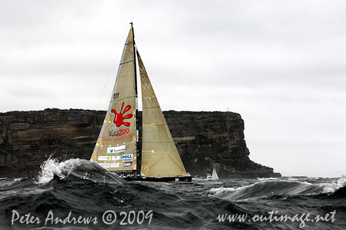 Ludde Ingvall's 90 foot maxi YuuZoo, at the heads and heading offshore after the start of the Rolex Sydney Hobart 2009. Photo copyright Peter Andrews, Outimage Australia.