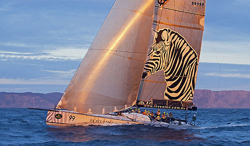 Sean Langman's 100-foot Elliott Investec Loyal, catches the sunset off Tasman Island during the Rolex Sydney Hobart 2010. Photo copyright Rolex and Daniel Forster.